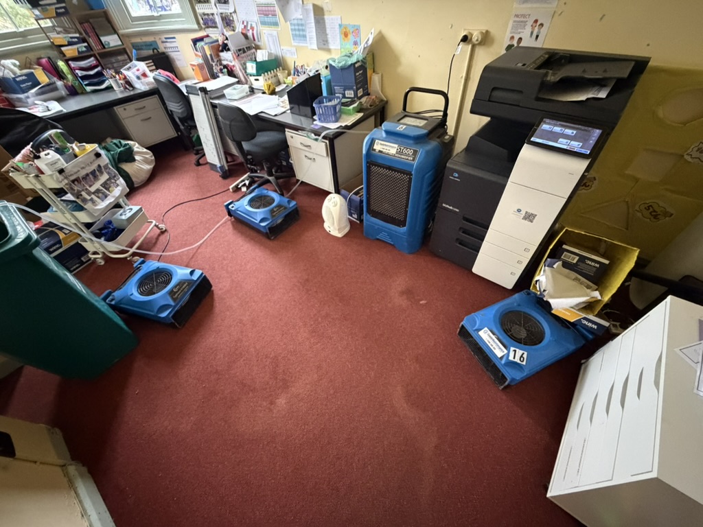 Industrial drying equipment deployed in flooded school office